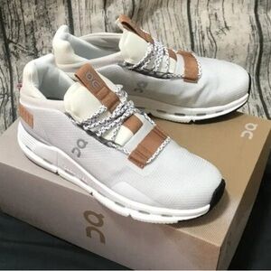 On Running Cream and Brown Sneakers